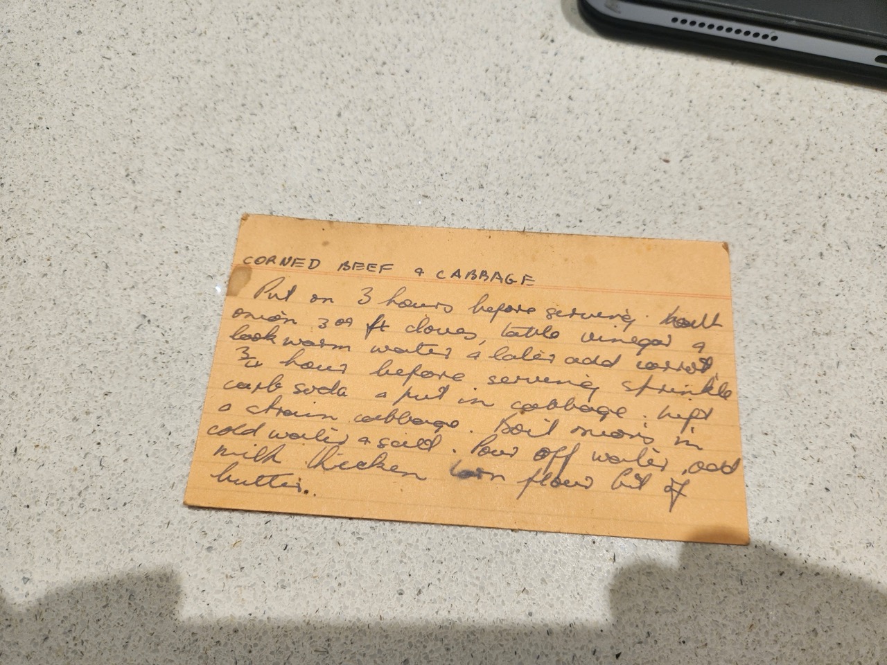 Corned silverside beef with cabbage, white sauce, and onions